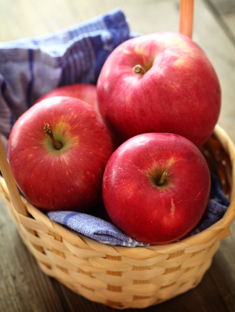 red apples in a basket, shallow dofの写真素材