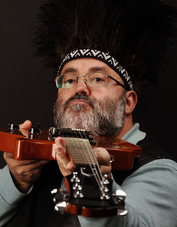 portrait of a man playing the electric guitar