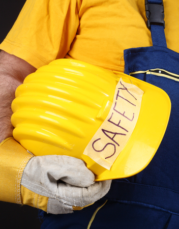 Man holding yellow helmet close upの写真素材