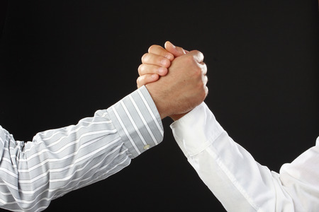 hands over black , arm wrestling business