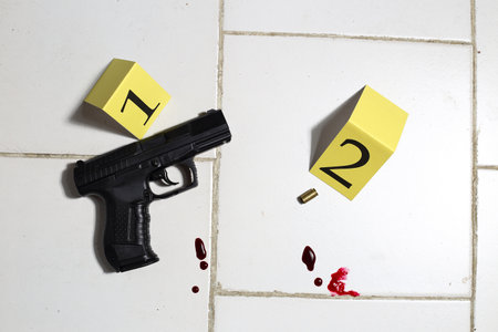 A crime scene with a gunの写真素材
