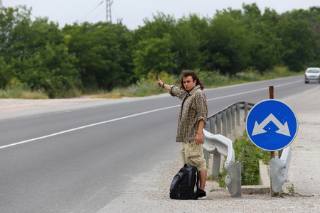 Young hitchhiker hopes to transportの写真素材