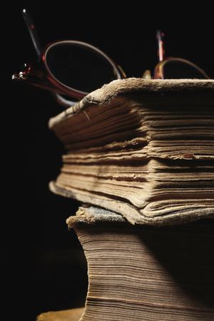stack of old books and glasses, selective focusの写真素材