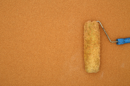 roller brush on a cork surfaceの写真素材