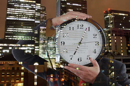 businessman holding a clock, time to work concept