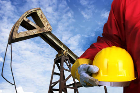 Worker and old oil pump jackの写真素材