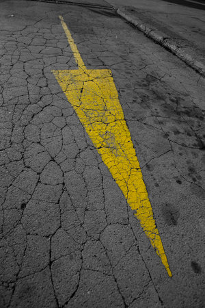 yellow road arrow pointing down