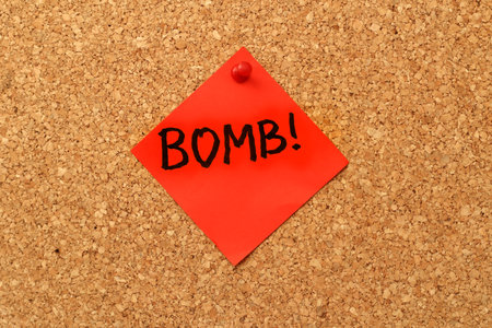 note bomb on a cork boardの写真素材