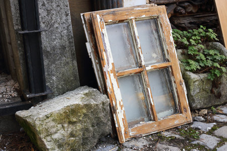 an old woodwork window in the backyard