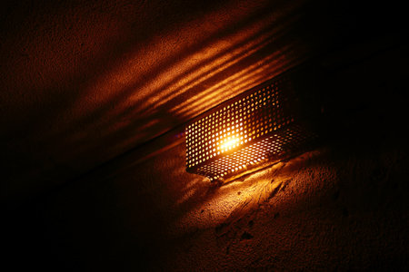 lamp with a protective metal case with holes. underpass lighting