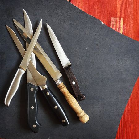various kitchen knives on the cooking tableの写真素材