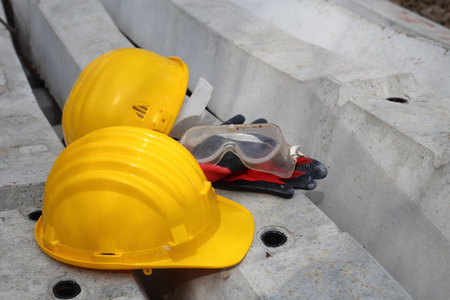 safety first yellow helmet at the work place