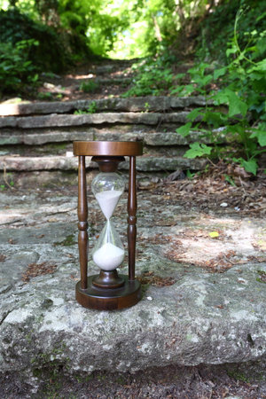a hourglass in summer forest