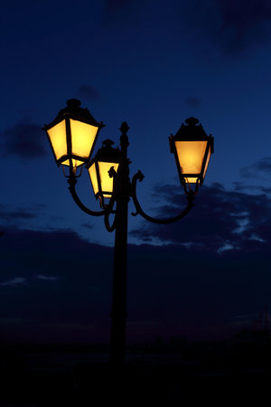 street lantern lighting in night, dramatic skyの写真素材