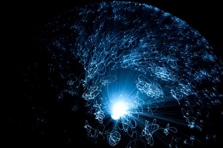 Close and aerial capturing the motion of an illuminated fibre optic lamp with black background.の写真素材