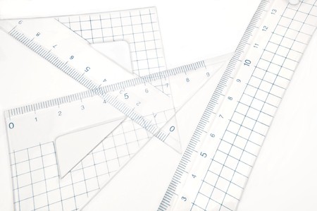 Close up of a plastic geometry set arranged over white.の写真素材