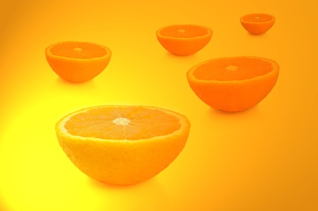FIve freshly cut orange halves arranged over vibrant yellow and gold light effect.の写真素材
