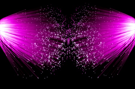 Two illuminated groups of bright pink fibre optic strands emanating from the left and right of the...