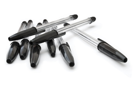 A selection of black ink pens arranged over whiteの写真素材