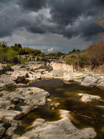 waiting for water. the empty river bed of the alcantara near fondaco motta in sicily in italyの写真素材