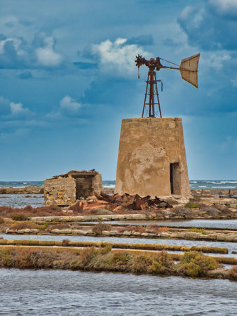wind turbine in the salt flats of nubia in sicily