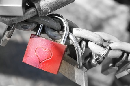 Red padlock with an engraved heartの写真素材
