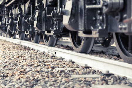 Many heavy railroad wheels on a track