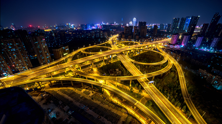 view of a city and highway at night