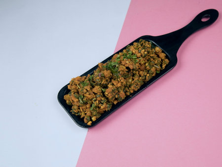 Fried minced pork in a black frying pan