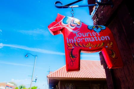 Close up of a hanging red sign in the shaped of horseのeditorial素材