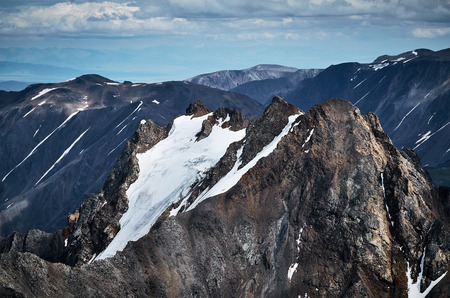 ice peak of Altay mountain covered by snow and ice of internal glaciersの写真素材