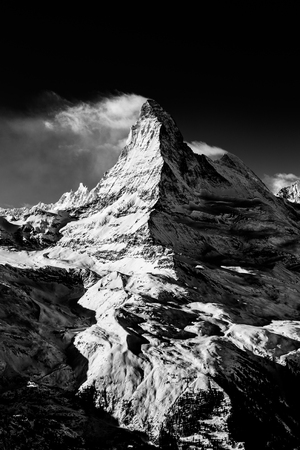 winter Matterhorn in evening covered by cloudsの写真素材