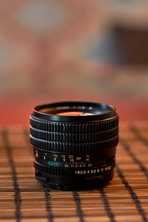 Mamiya lens  80 mm situated is on the table on a blurred background with bokehの写真素材