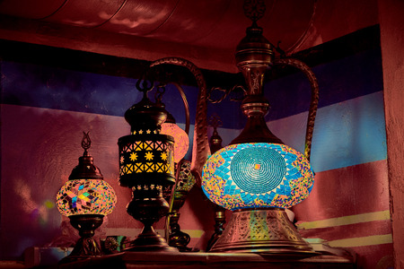 Arab ethnic lamps Aladdin lamp glowing red yellow and blue colorsの写真素材