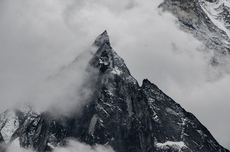 panoramic beautiful view of Ama Dablam covered by clouds from trek to Everset in  contrast view.の写真素材
