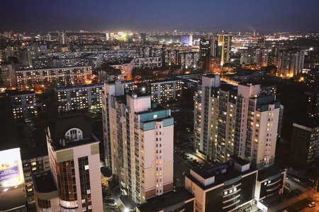 aerial shot of the Siberian capital Novosibirsk city at sunset in early cold springの写真素材