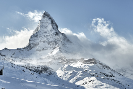 great view of Matterhorn East face in a bright winter day with a good weather with a little bit clouds nearbyの写真素材