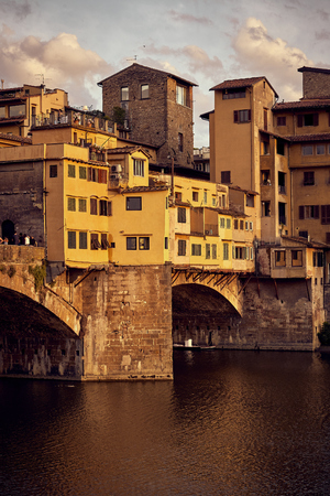 View of Gold Ponte Vecchio Bridge in Florence at the sunsetの写真素材
