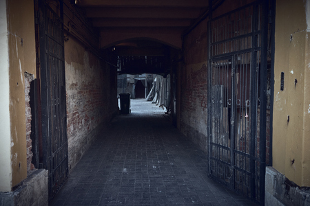 Entrance arch to the old courtyards of residential buildings of Saint petersburgの写真素材