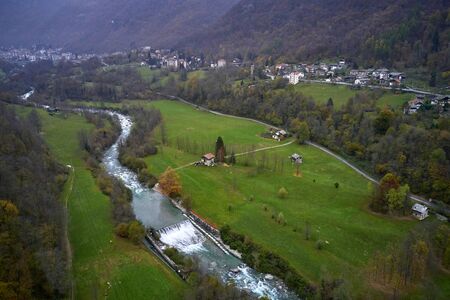 Little Italian village among the Alps in autumn dayの写真素材