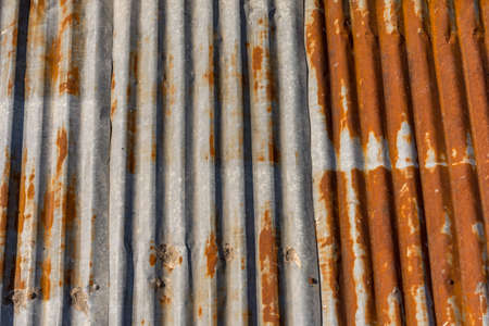 Old corrugated metal roof with surface rust.の写真素材