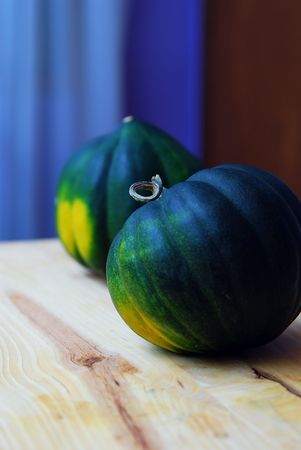 Two organic Acorn Squash .Studio shot .Blue backgroundの写真素材