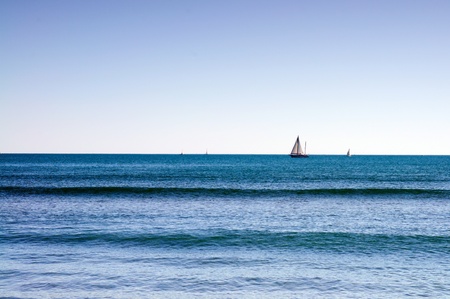Seascaoe with sailboat on the mediterranean seaの写真素材