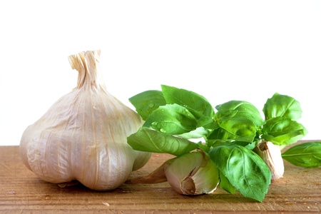 Garlic and basil on white backgroundの写真素材