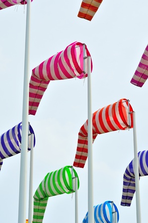 Colorful windsocks in yachting portの写真素材