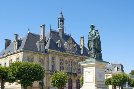 City Hall of St Jean d'Angely with bronze statue of Regnaud de St Jean d'Angely, Charente Maritime, Franceのeditorial素材