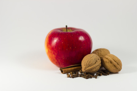 apple, cinnamon, cloves, nuts