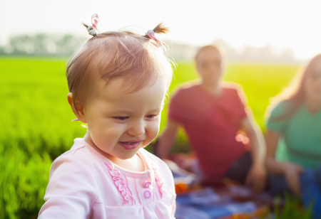 Picnic on the grass. Happy familyの写真素材