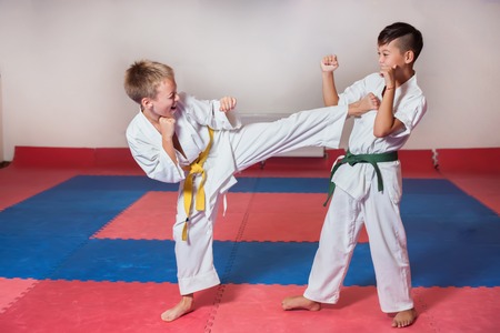 Children during training in karate. Fighting position, active lifestyle, practicing fighting techniquesの写真素材