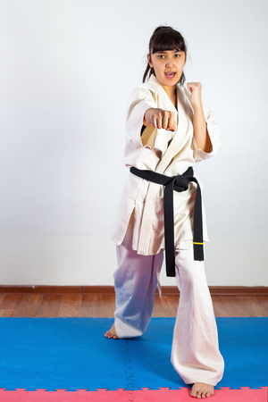 Woman demonstrate martial arts working together. Fighting position, active lifestyle, practicing fighting techniquesの写真素材